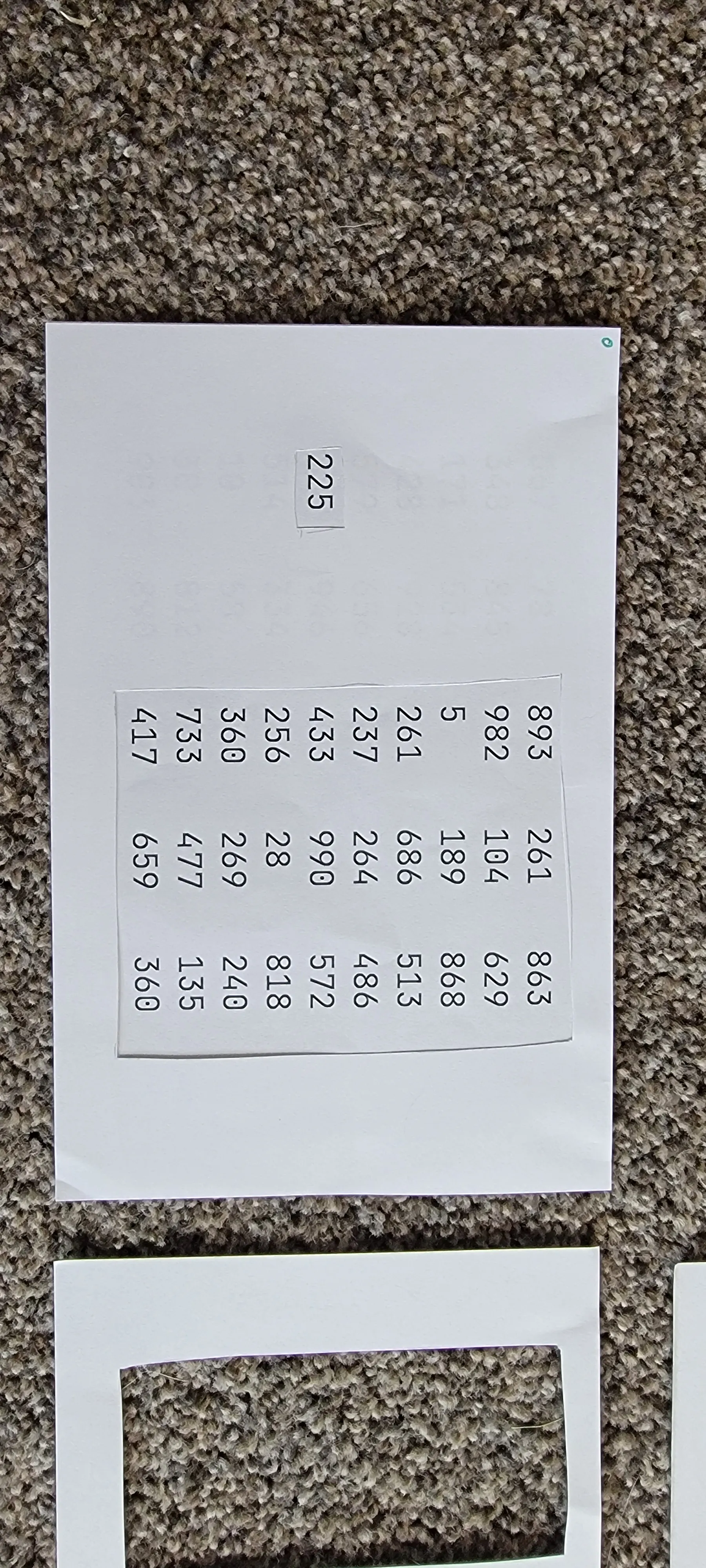 two pieces of paper: one with array of numbers and one filter set on top