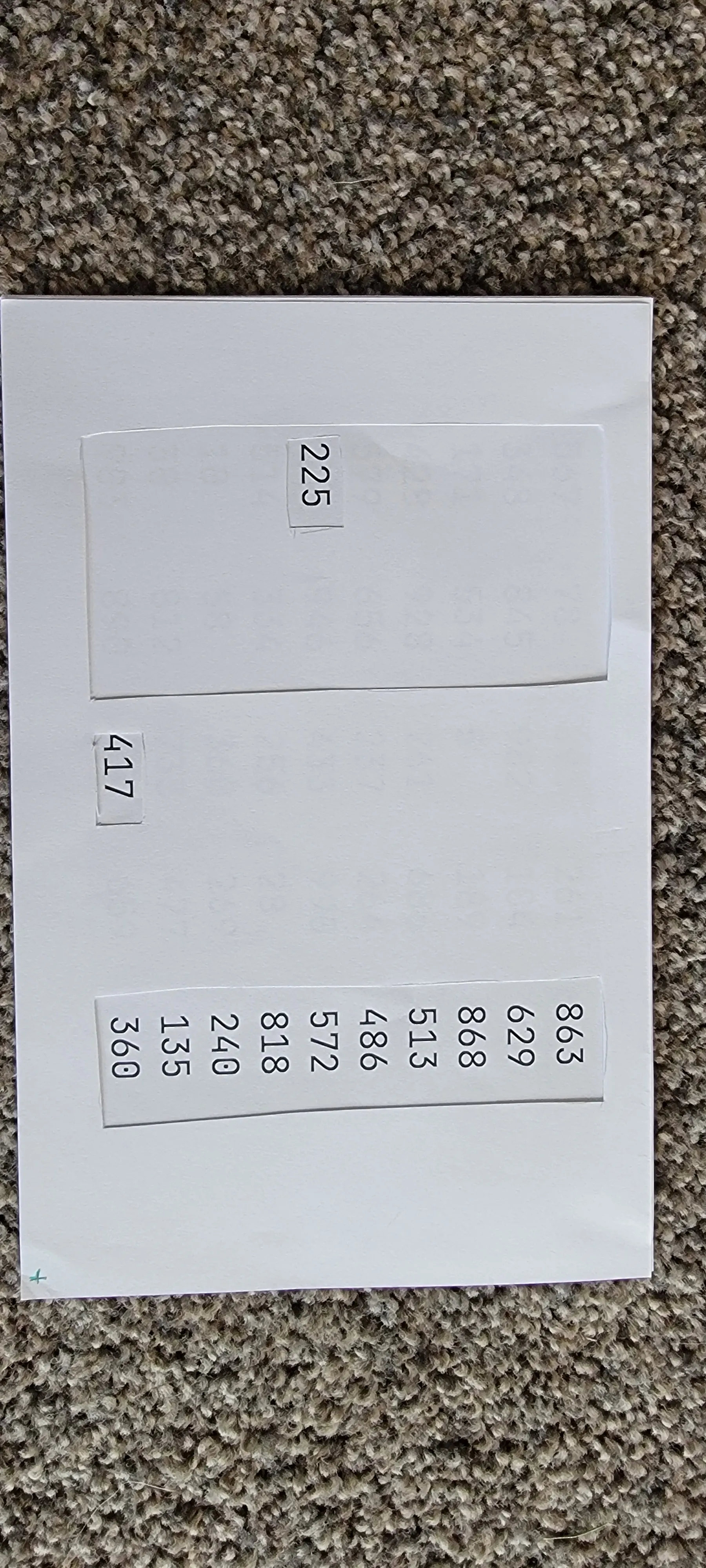 two pieces of paper: one with array of numbers and two filters set on top