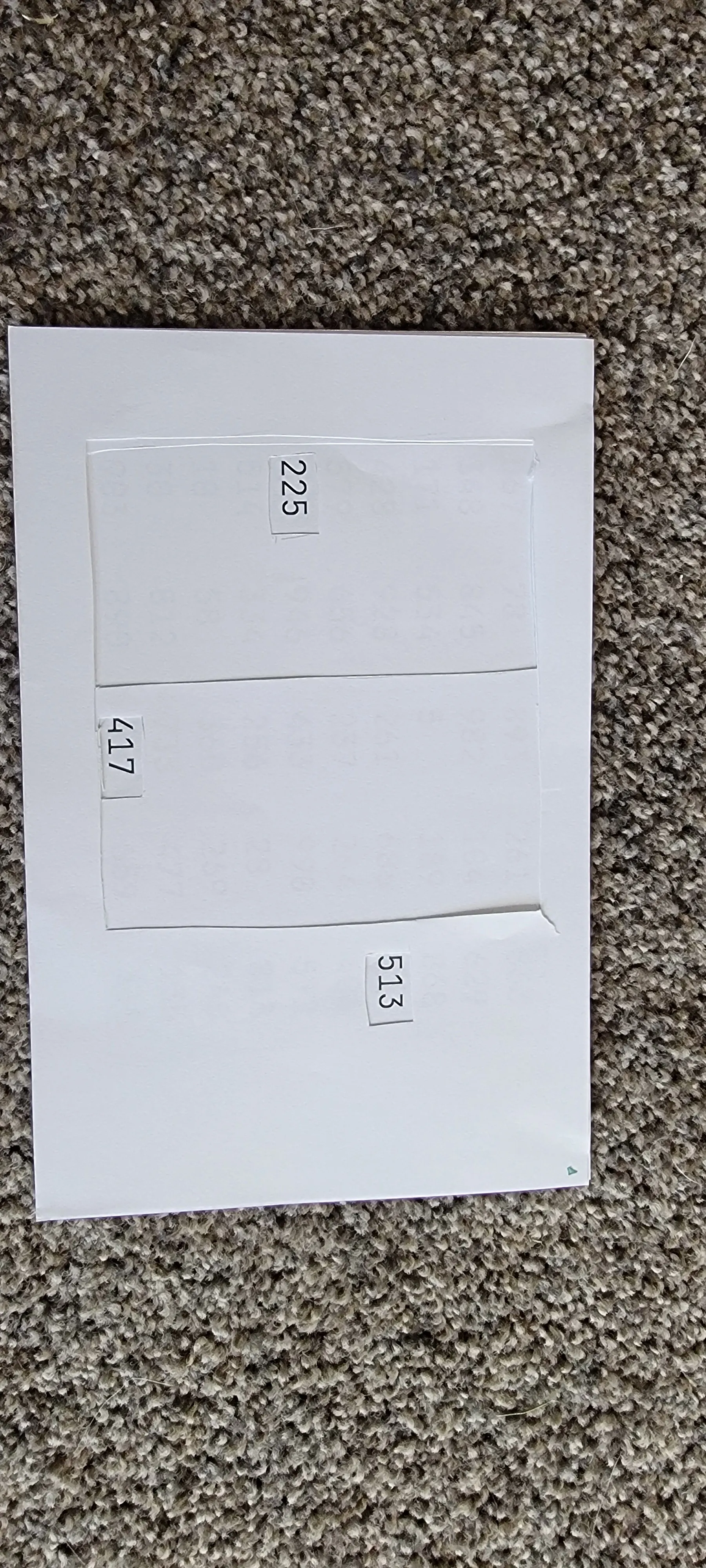 two pieces of paper: one with array of numbers and three filters set on top